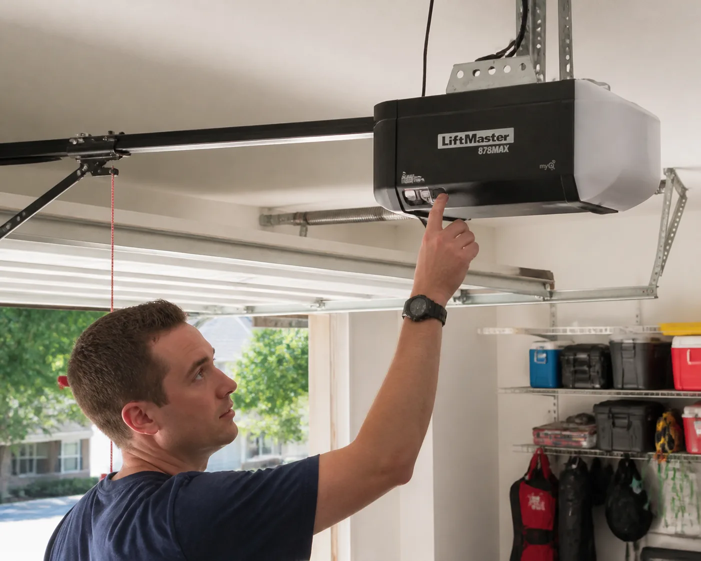 a homeowner programming a liftmaster 87.webp